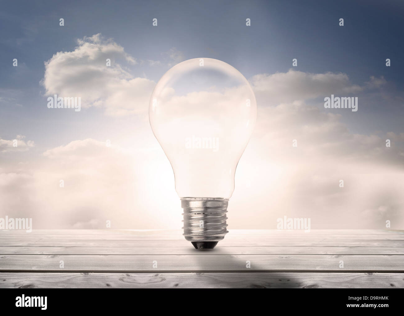 Light bulb standing floorboards in the sky Stock Photo Alamy