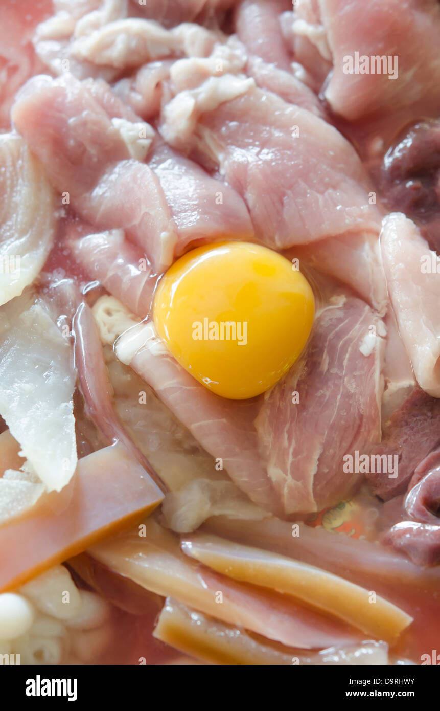 raw meat and fresh sliced pork , yolk egg prepare for cooking. Stock Photo
