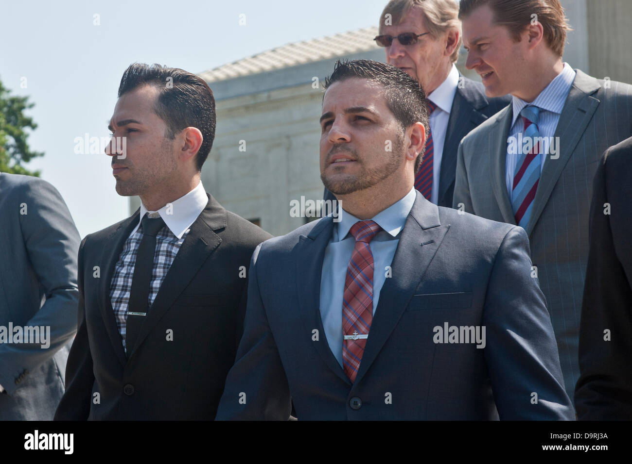 Washington DC, USA. 25th June 2013. Paul Katami (left) and Jeffrey Zarrillo (right) lead plaintiffs for Hollingsworth v. Perry to overturn Proposition 8 leave the US Supreme Court on Tuesday. Photo Credit: Rudy K/Alamy Live News Stock Photo