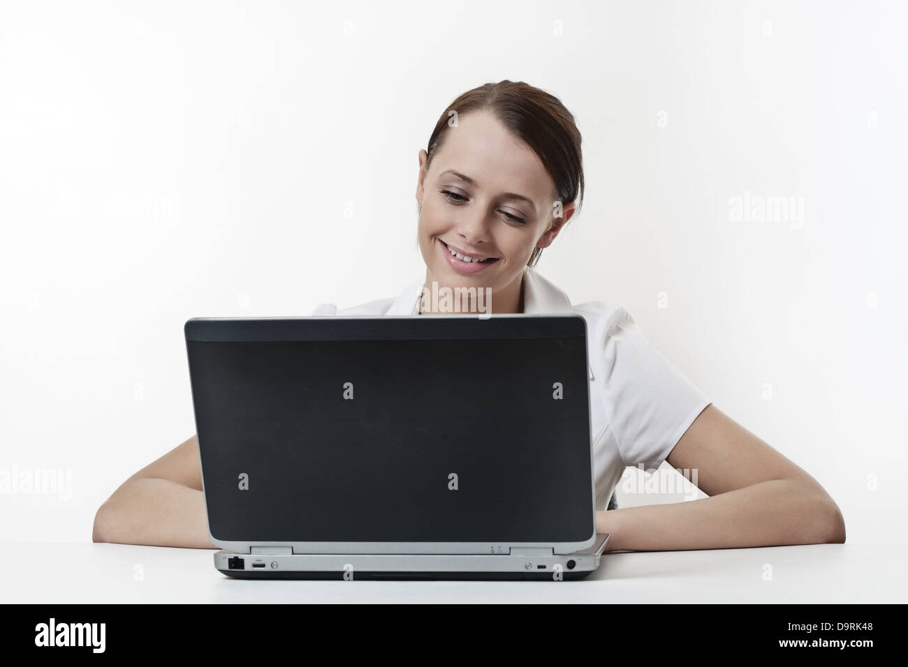 Portrait of a beautiful young woman working on laptop Stock Photo - Alamy