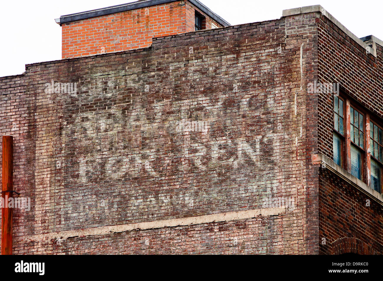 Ghost sign on the side of a building in Columbus, Ohio. Stock Photo