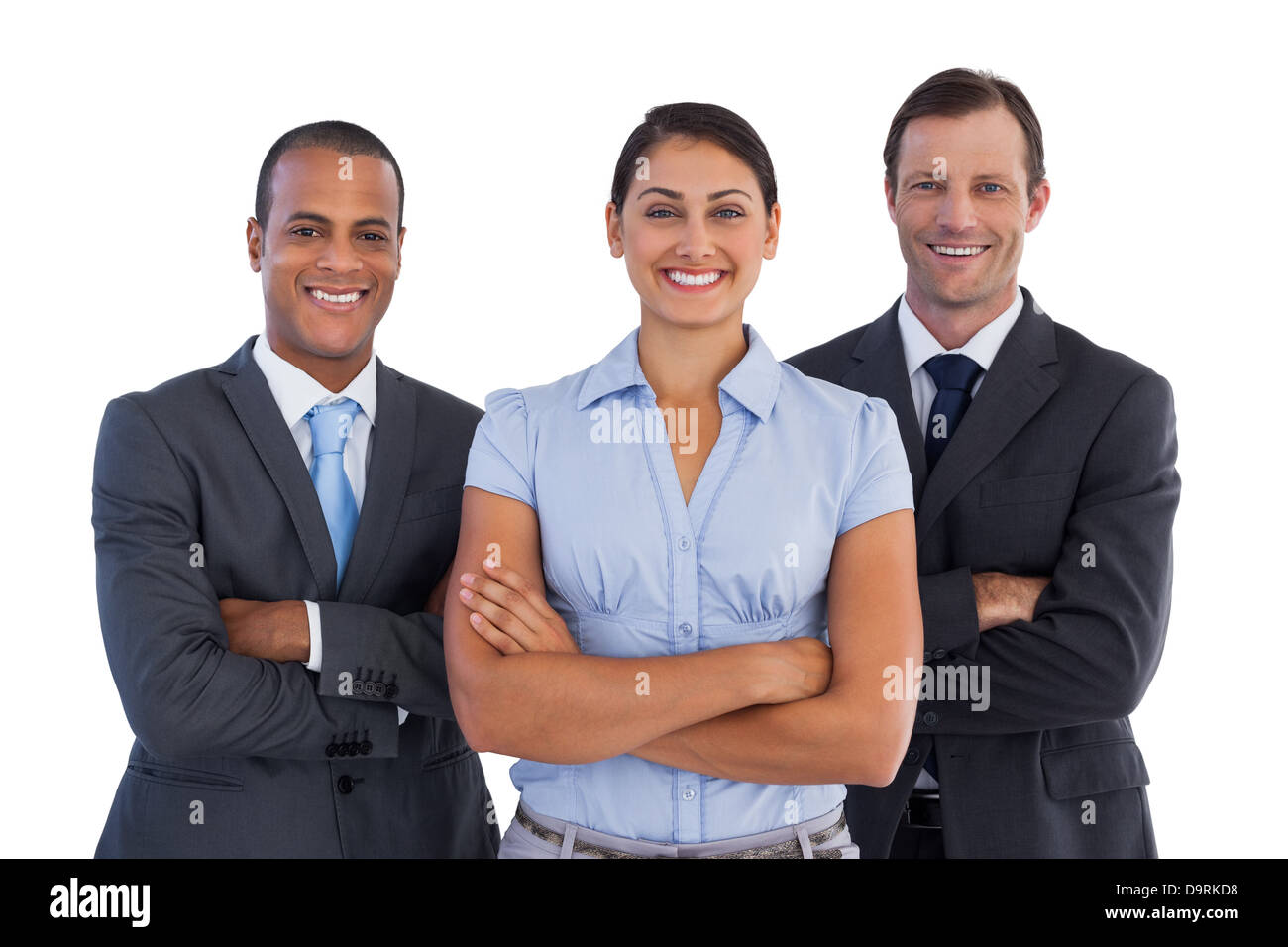 Small group of smiling business people standing together Stock Photo