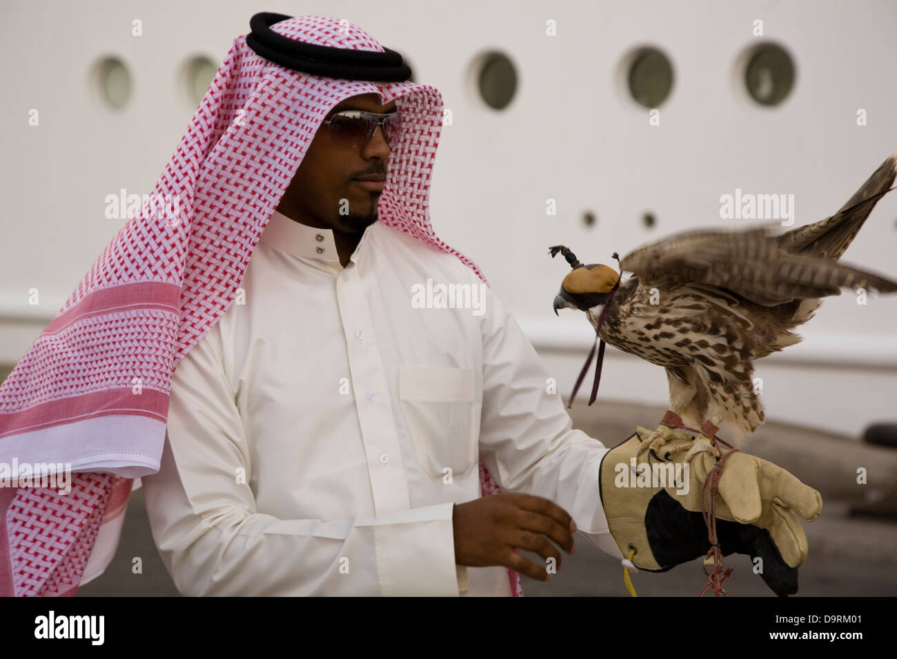 A falconer and his bird, Manama, Bahrain Stock Photo