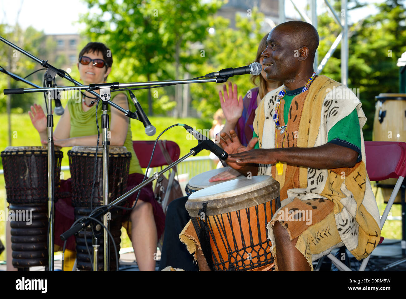 Njacko Backo group of African djembe drummers performing on stage at the Muhtadi Drum Festival Toronto Stock Photo