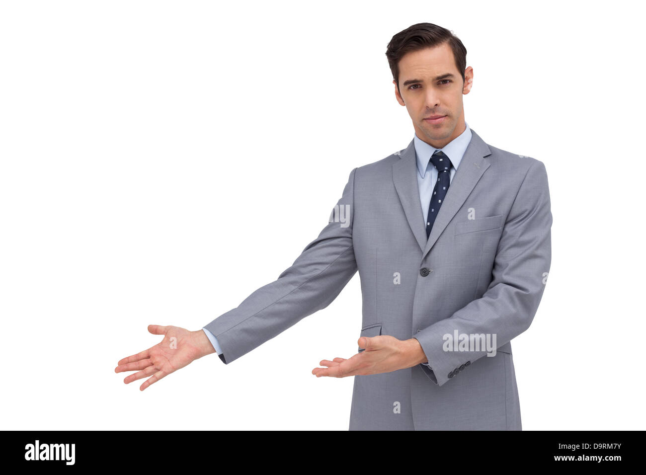 Serious businessman giving a presentation with his hands Stock Photo