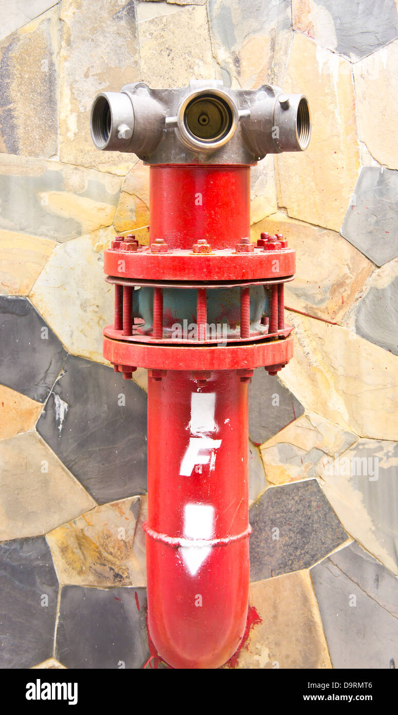 The fire hydrant on the wall Stock Photo Alamy