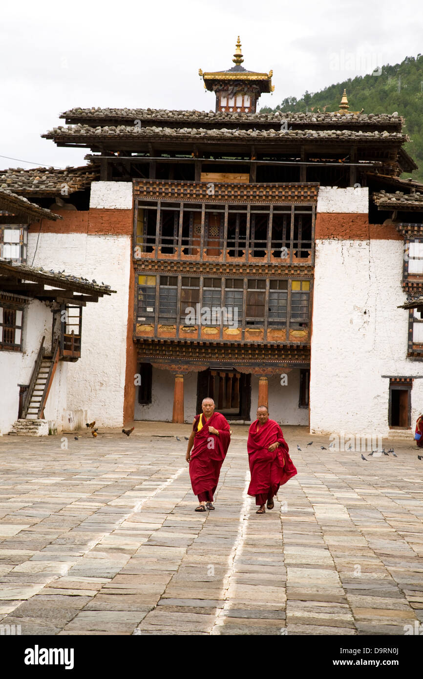 Monks at Punakha Dzong, built in 1637. Punakha Valley, Bhutan Stock Photo