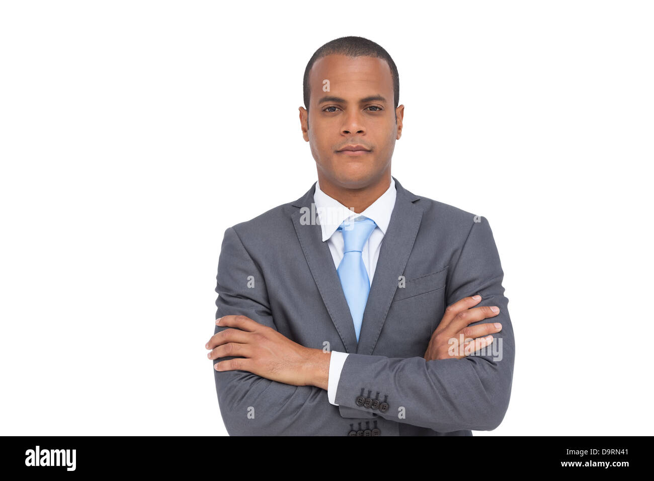 Charismatic businessman with arms crossed Stock Photo