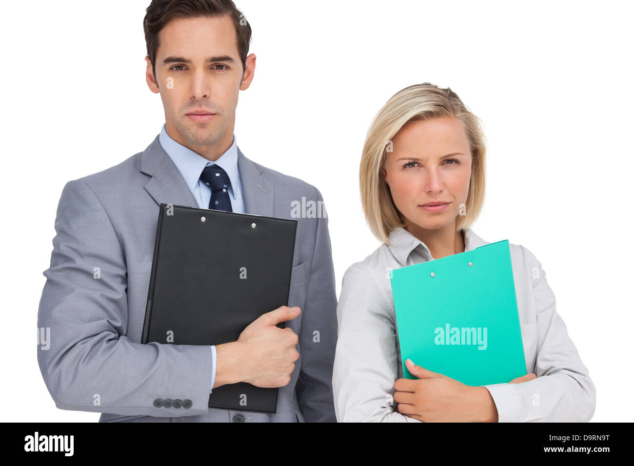 Serious business people standing together with folders Stock Photo - Alamy