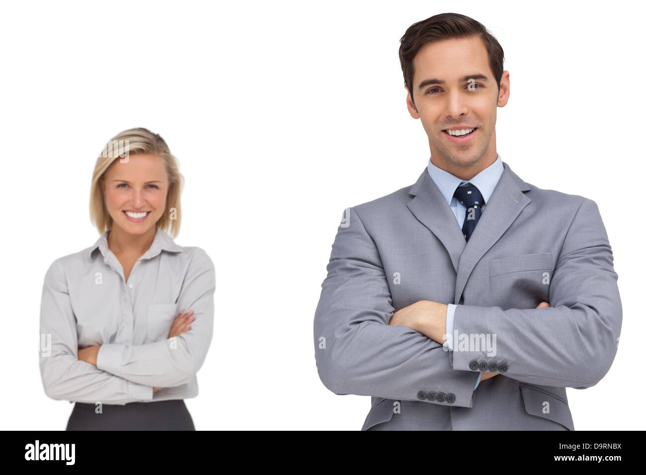 Smiling business co workers standing together Stock Photo - Alamy