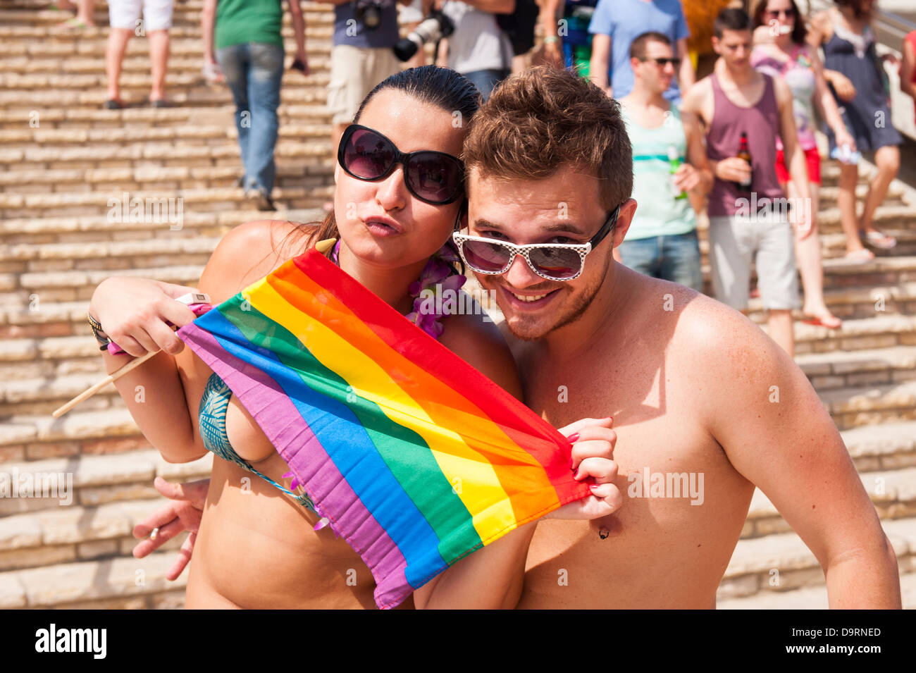 Israel Tel Aviv Gay Pride Gordon Beach by sea seaside Party couple goers revelers flag Rainbow LGBT colours colors Stock Photo