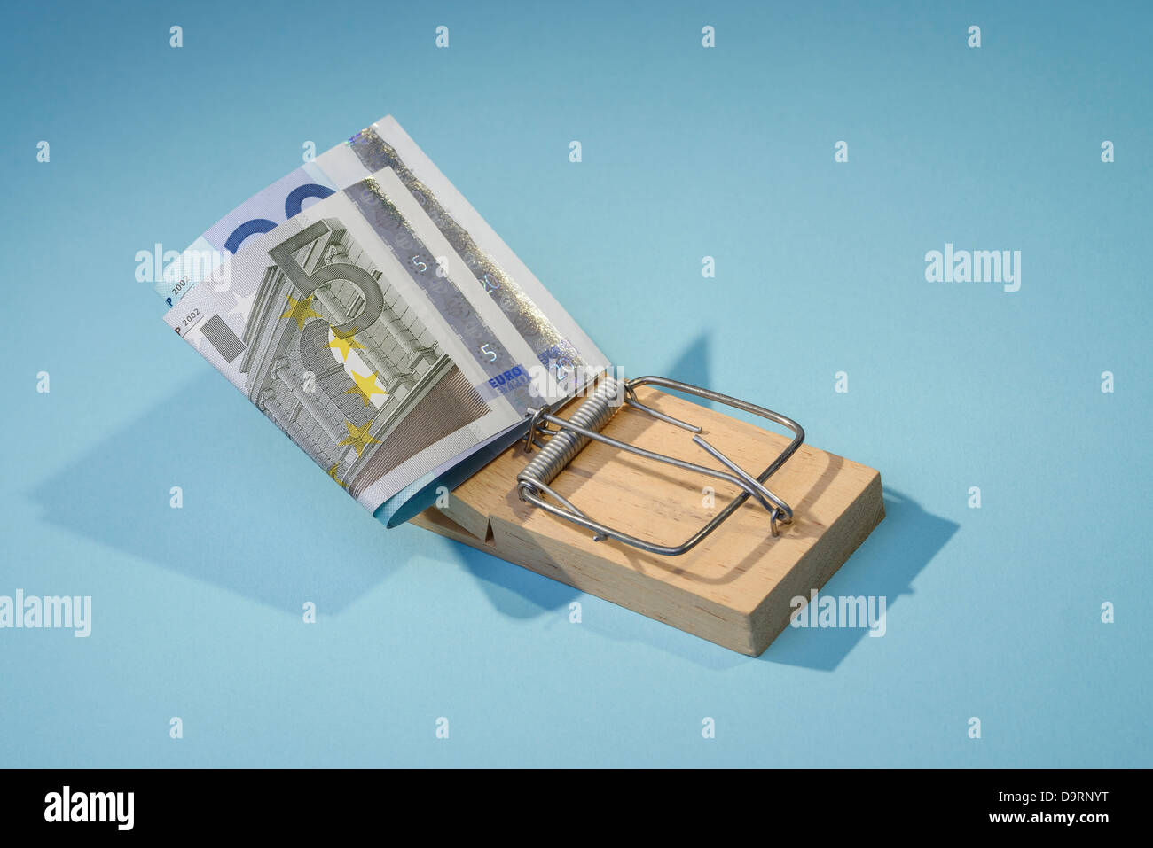 Euro notes in a mousetrap Stock Photo