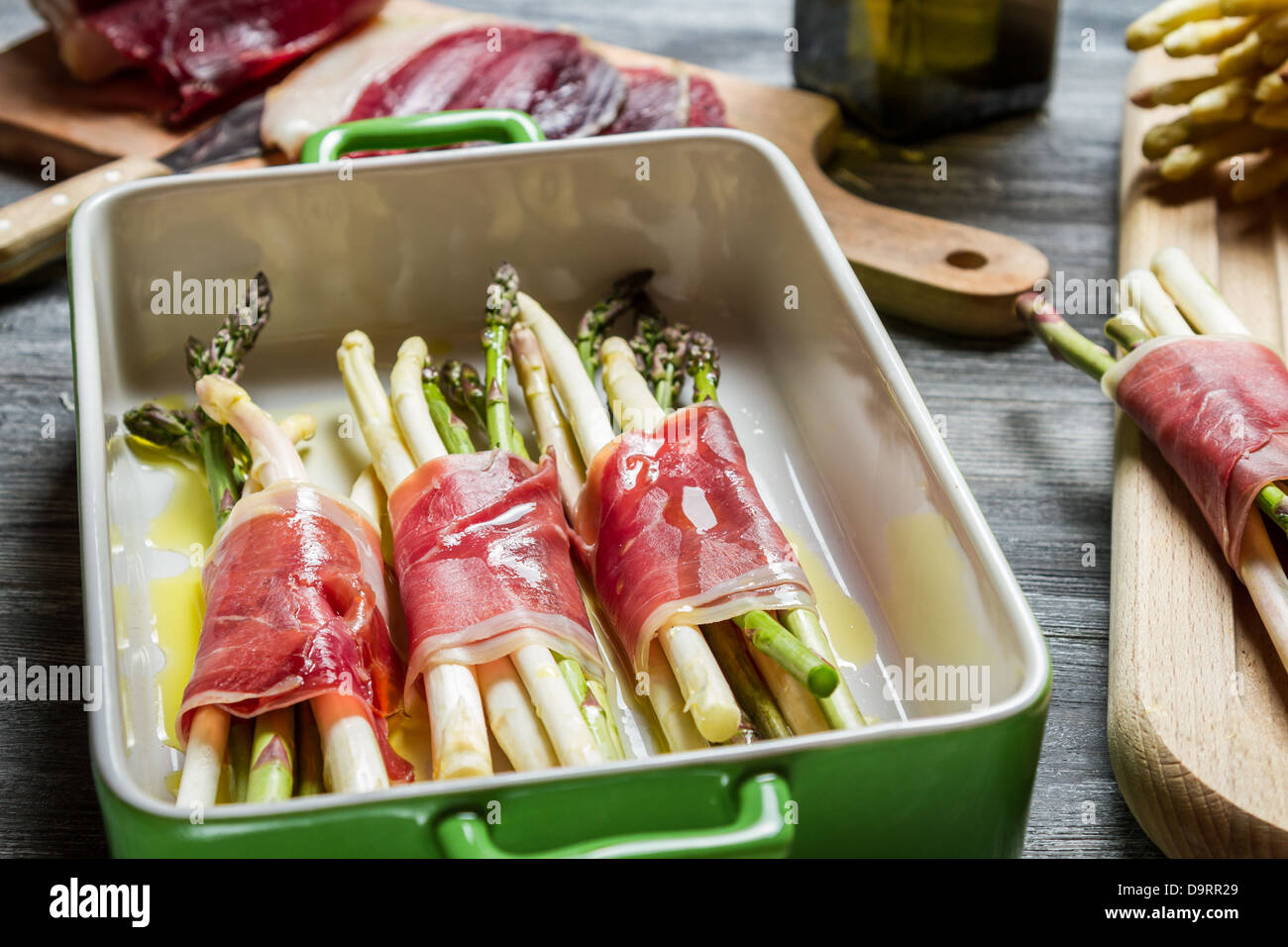 Asparagus wrapped in Parma ham casserole Stock Photo Alamy