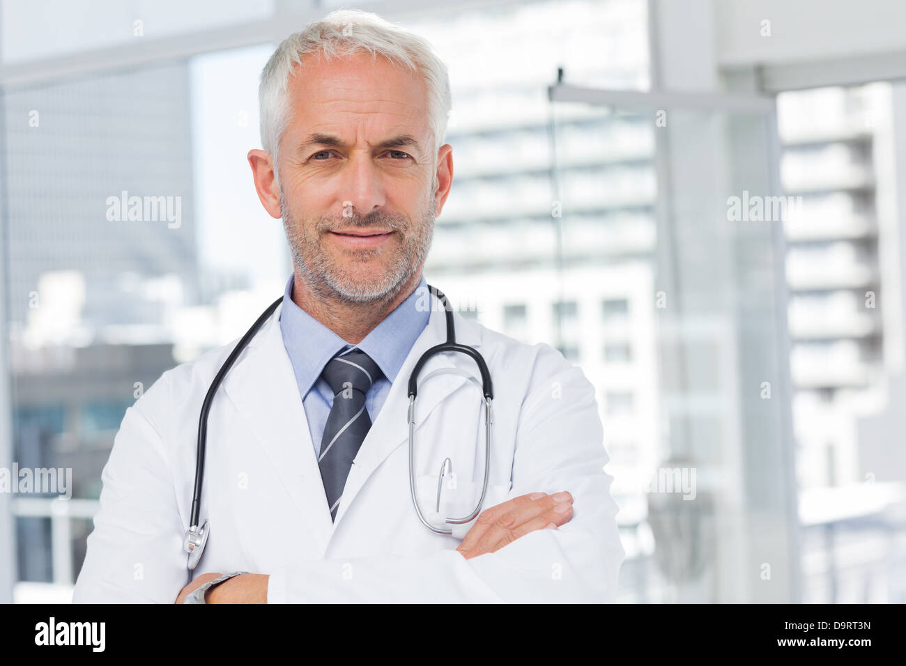 Doctor with stethoscope around his neck Stock Photo Alamy
