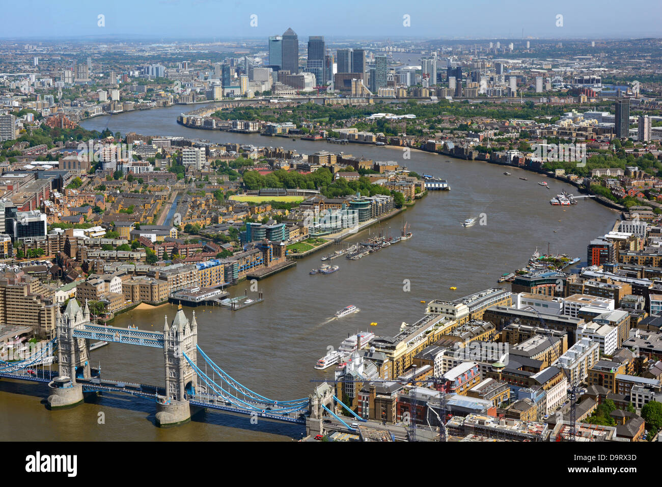 Aerial urban London landscape view from the Shard high tide River Thames from iconic Tower Bridge toward Canary Wharf skyline landmarks England UK Stock Photo