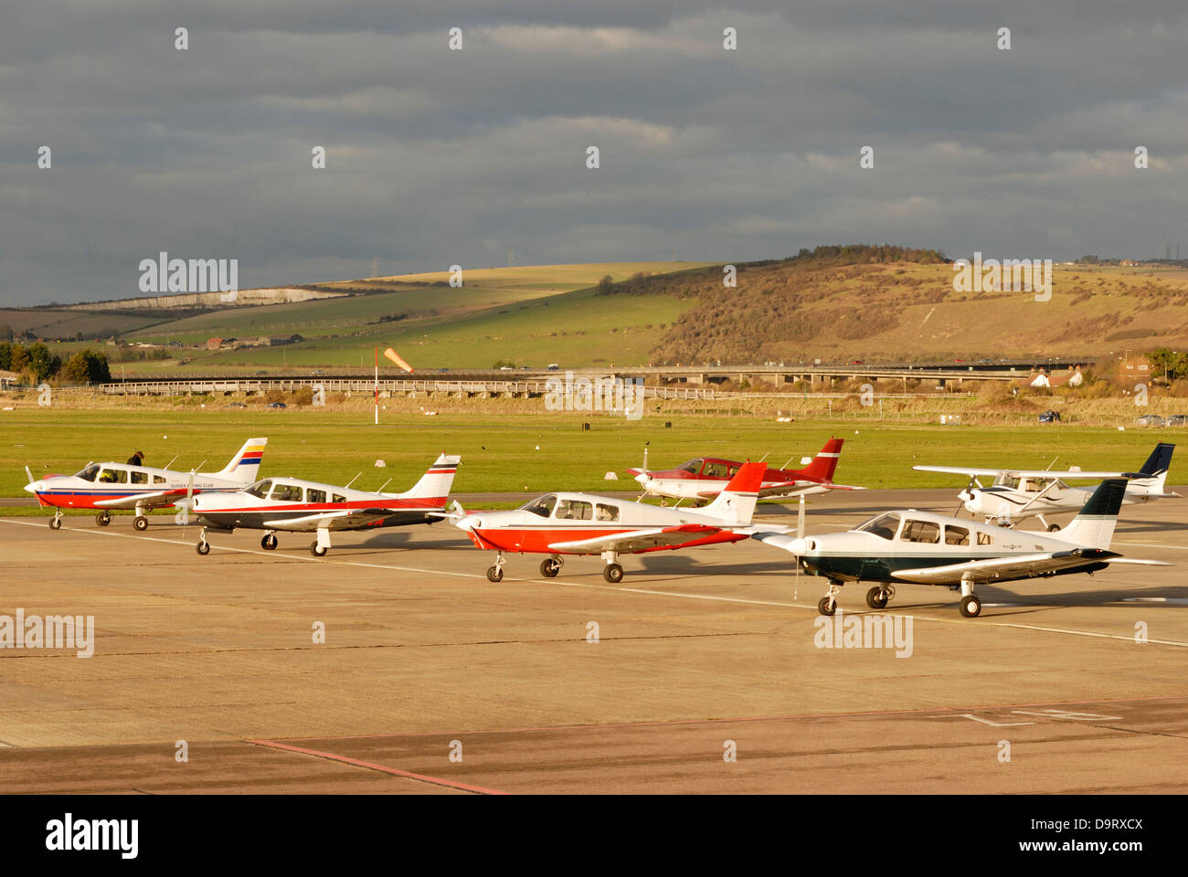 Small aircraft parked airside of the main terminal at Shoreham (Bright City) airport in West Sussex. Stock Photo