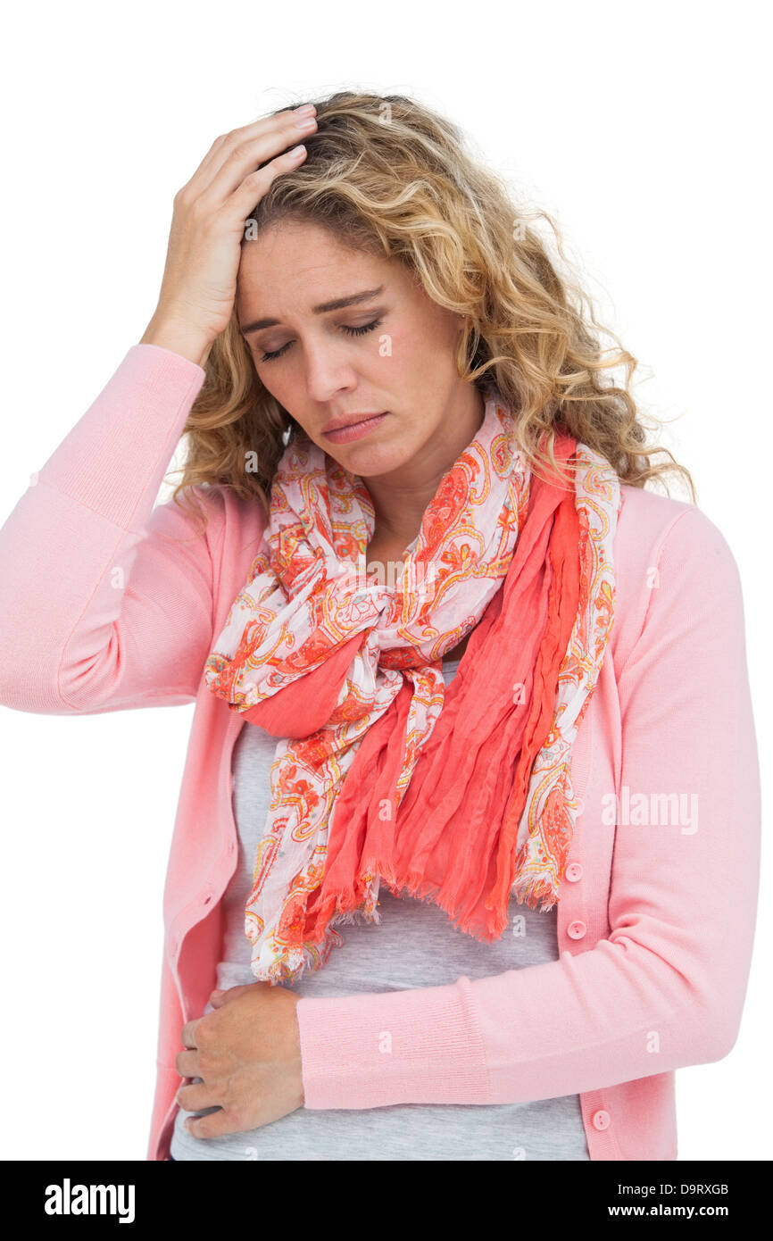 Blonde girl having both headache and belly pain Stock Photo