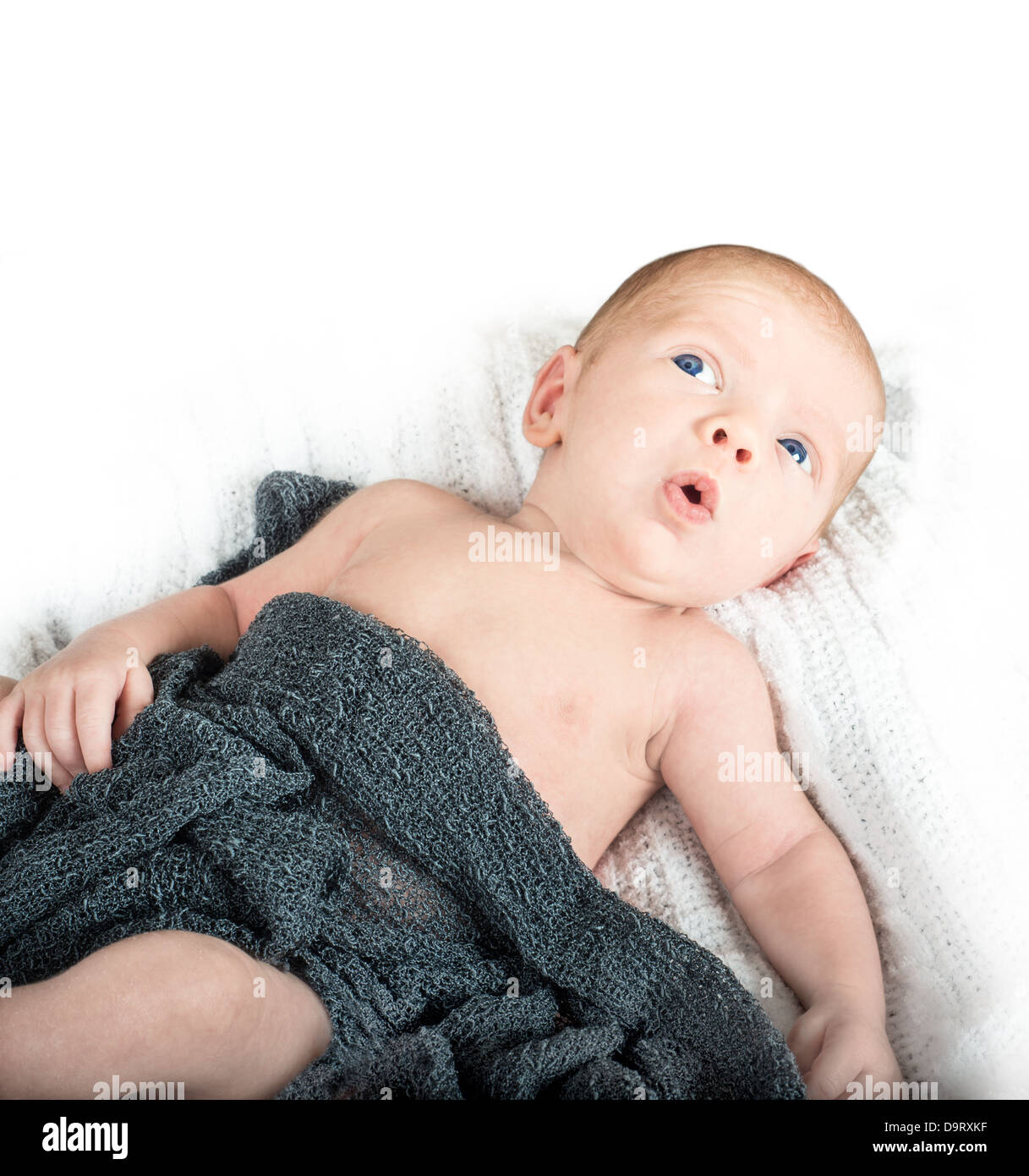 Adorable newborn baby looking up in surprise Stock Photo Alamy
