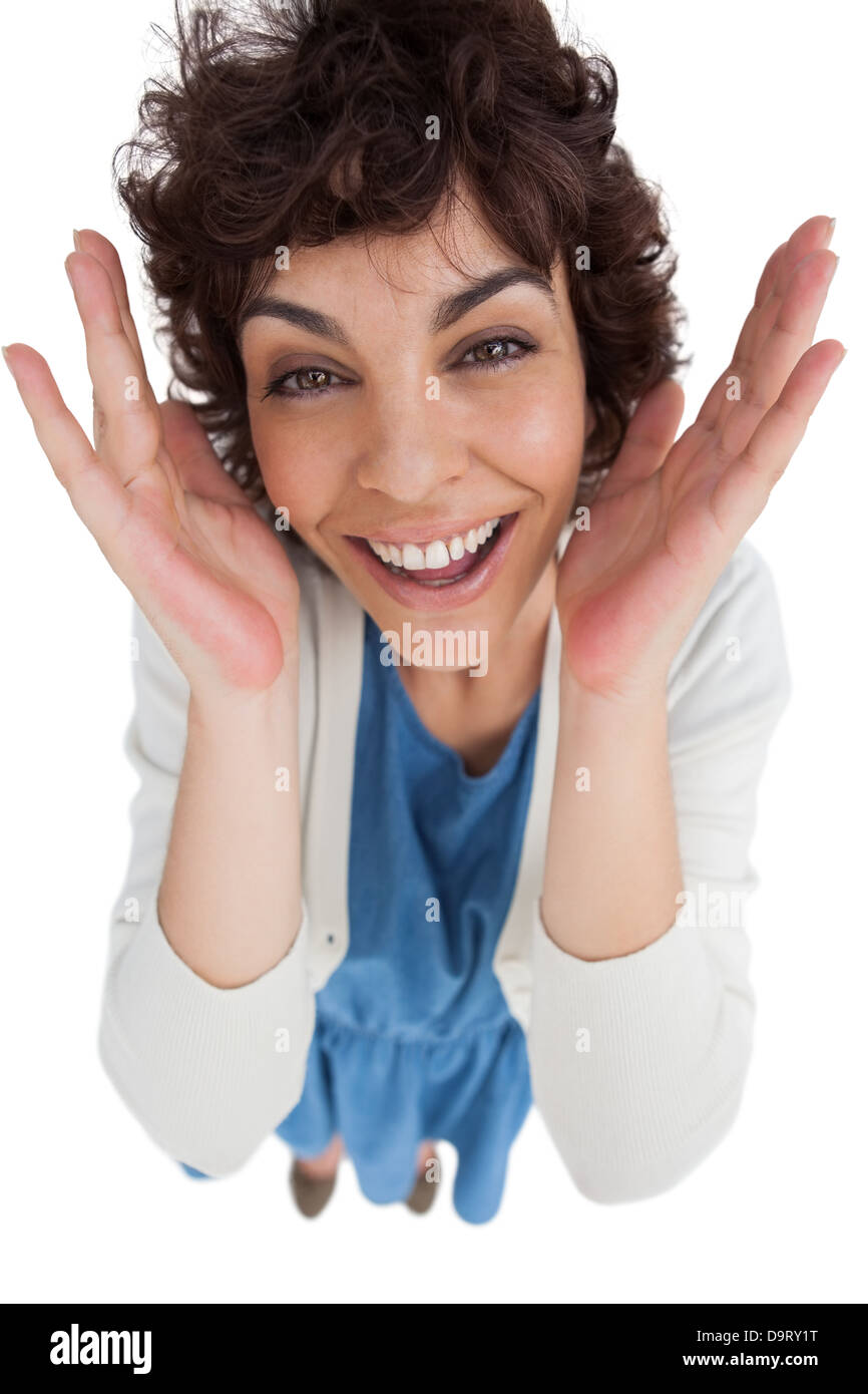 Overhead of amazed woman with hands wide opened Stock Photo