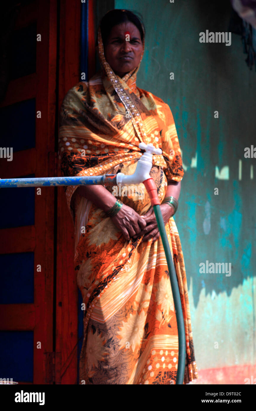 Nov 28, 2012 Belgaum, Karnataka, India A slum woman stands by a tap