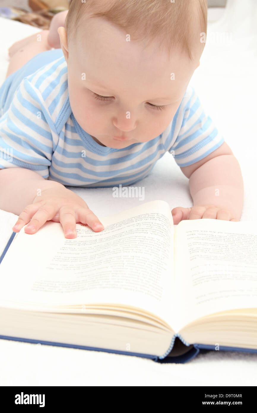 baby reading a book Stock Photo