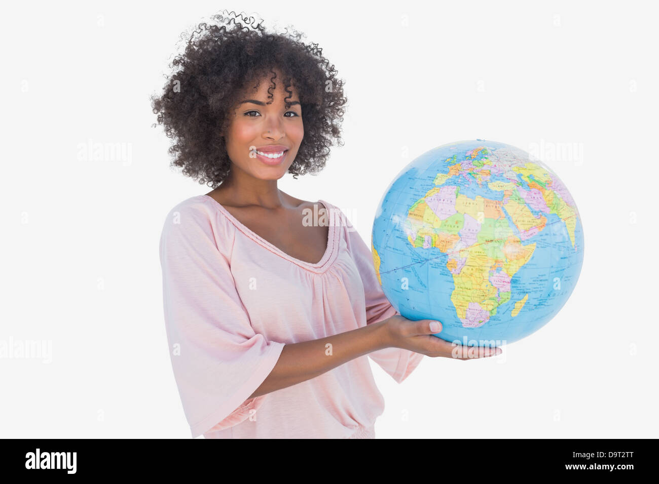 Happy woman holding globe Stock Photo