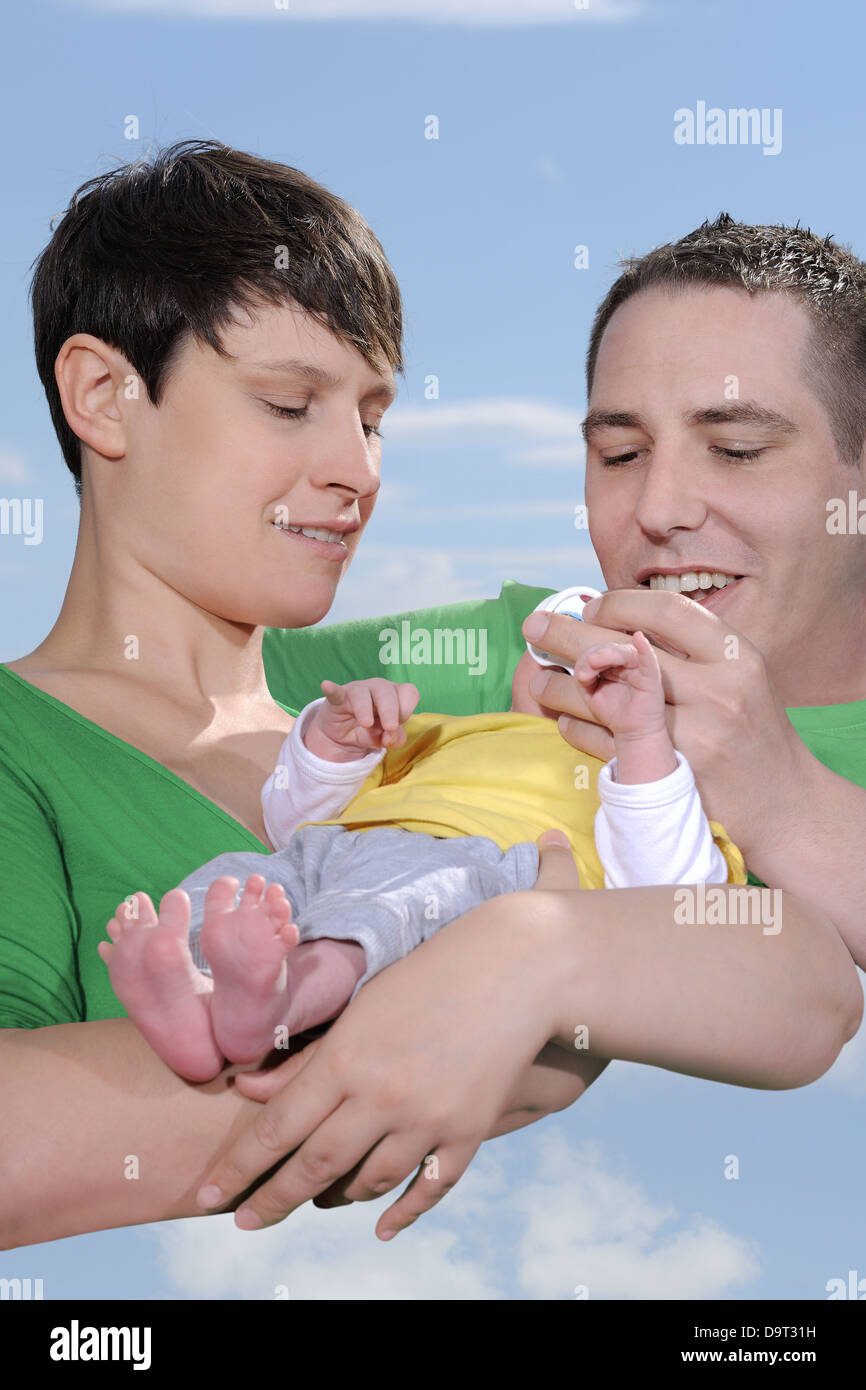 Happy family mother father and baby Stock Photo