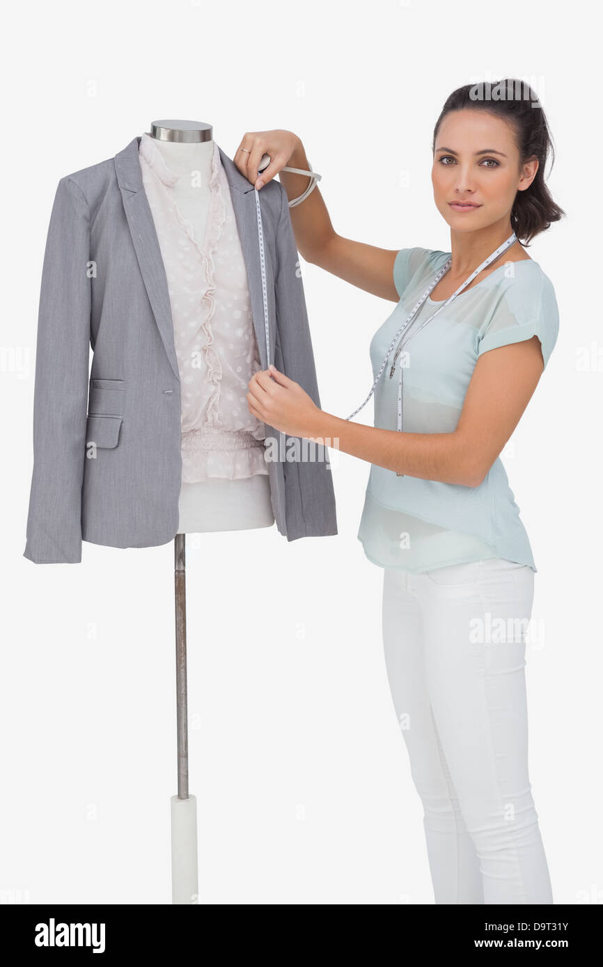 Fashion designer measuring blazer Stock Photo