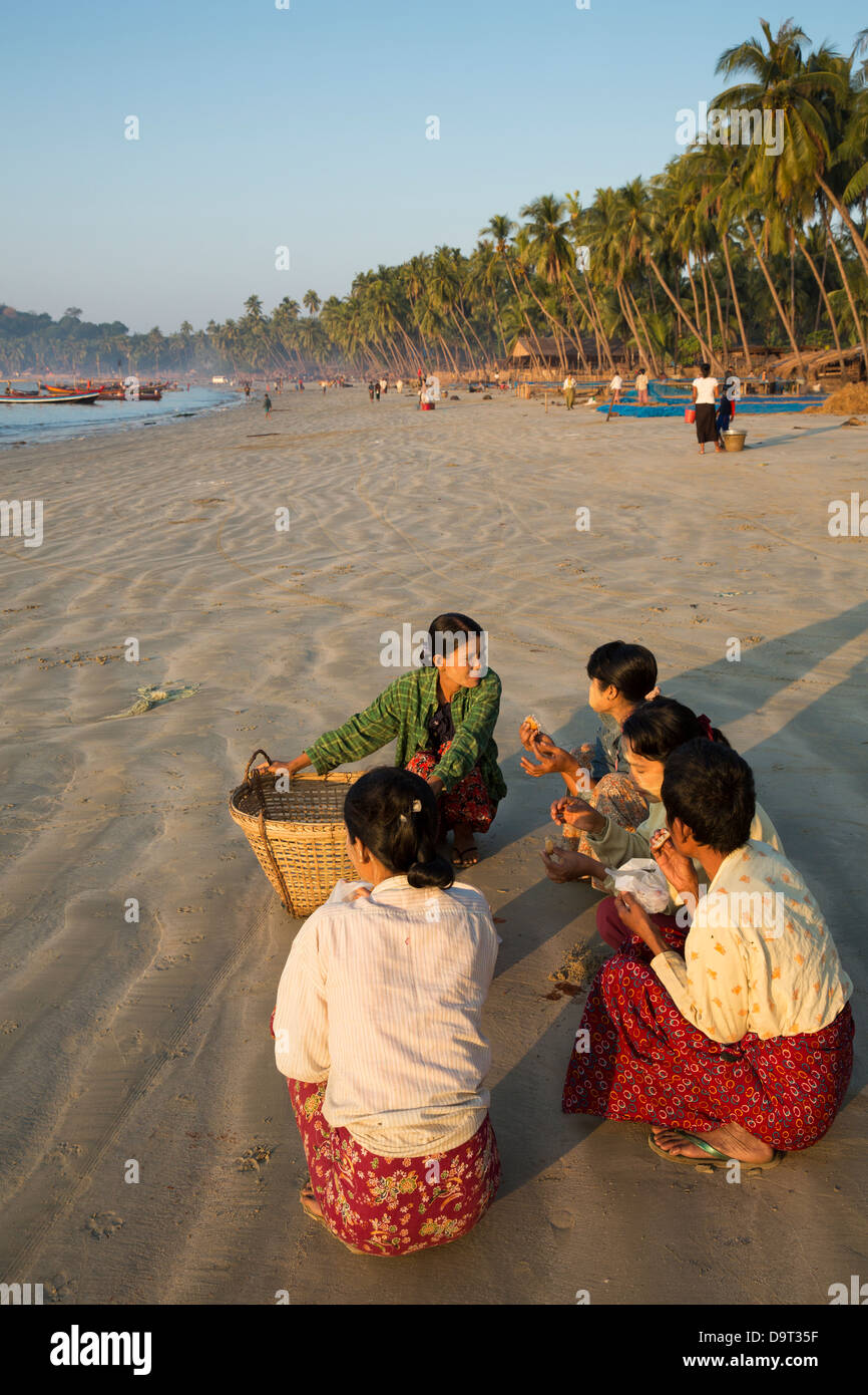 women on the beach at Gyeiktaw, Ngapali, Rakhine, Myanmar (Burma) Stock Photo