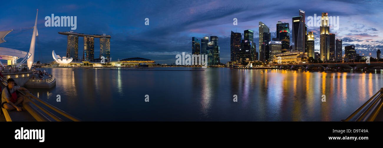 the skyline at night from the Esplanade with Marina Bay (left) and the Central Business District (right), Singapore Stock Photo
