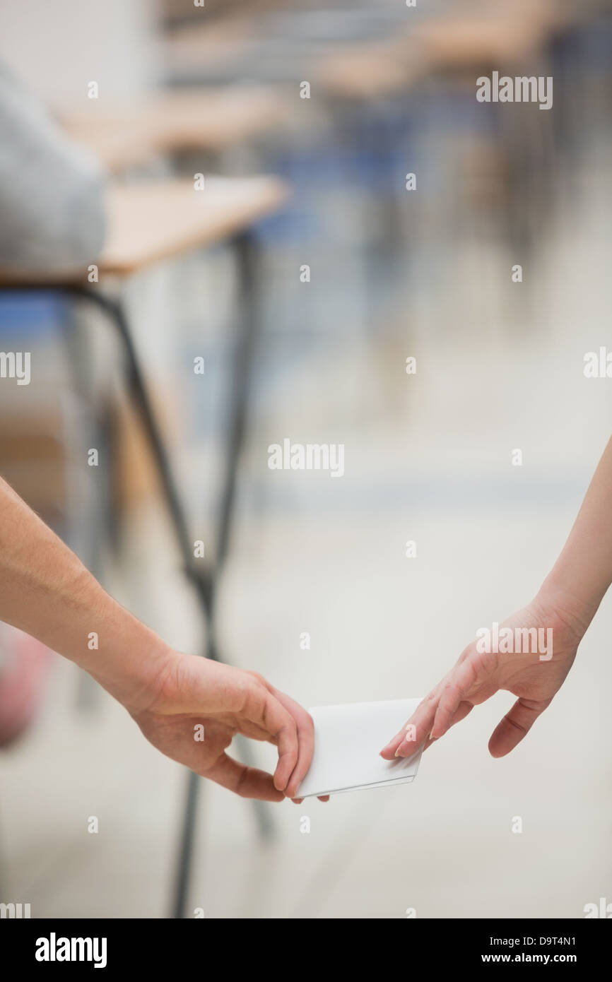 Two students cheating while doing a test Stock Photo