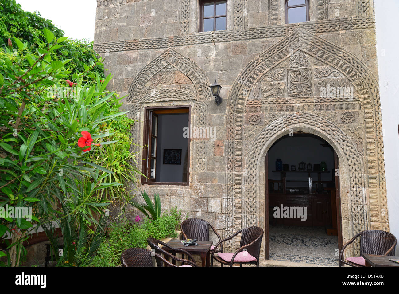 Courtyard carvings in 16th century Captain's House Cafe Bar, Lindos