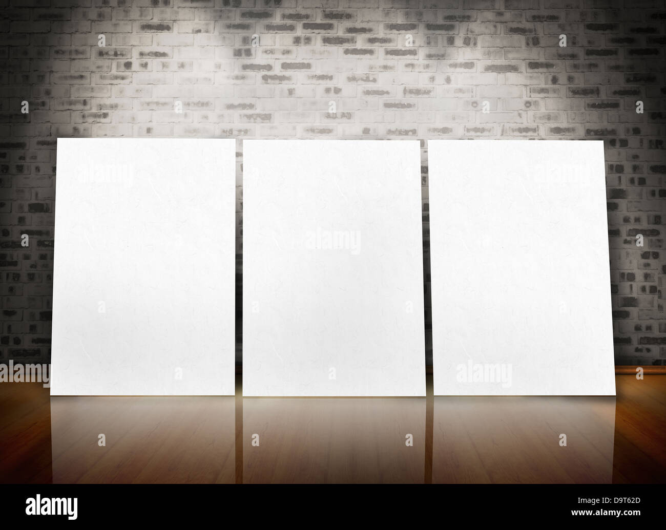 Three posters standing in line in a parquet floor like an art exhibition Stock Photo