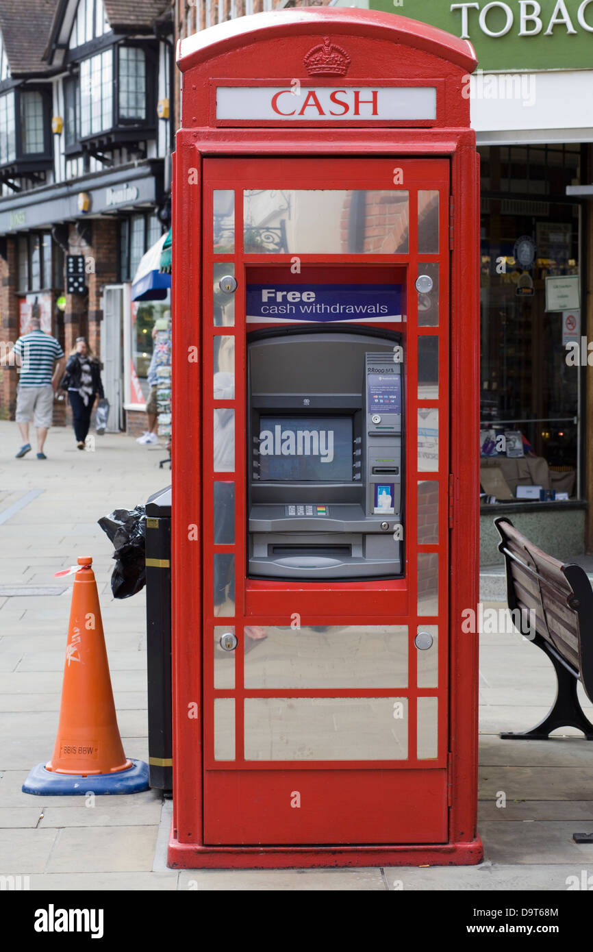 Unusual Novelty fully working cash machine in a Red Telephone box in Stratford upon Avon Warwickshire England UK Stock Photo