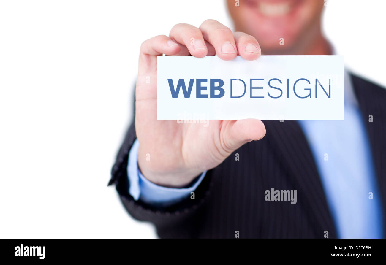 Businessman holding a label with web design written on it Stock Photo