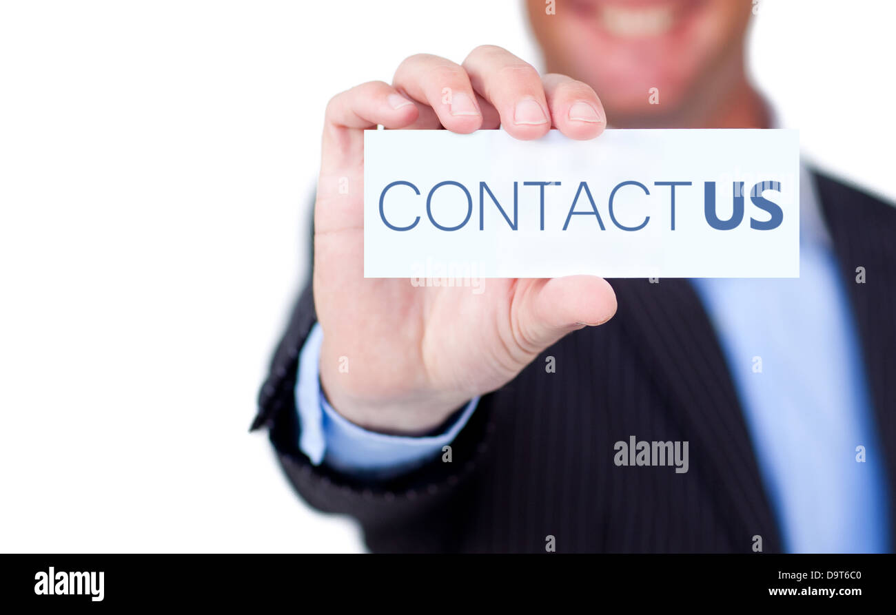 Businessman holding a label with contact us written on it Stock Photo