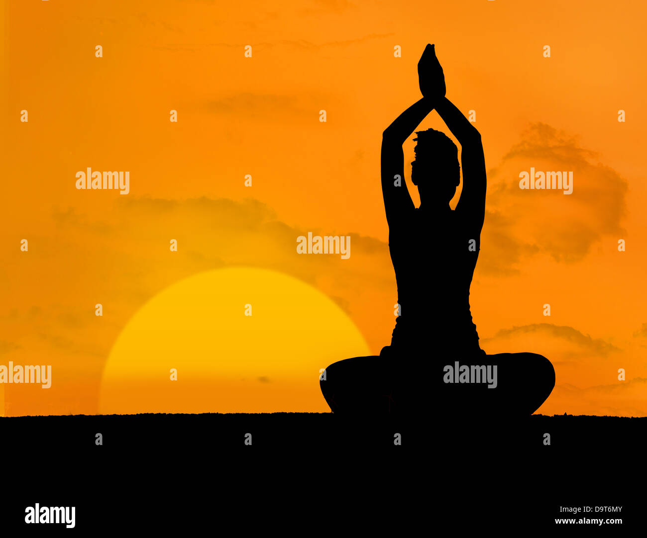 Calm silhouette of woman doing yoga Stock Photo