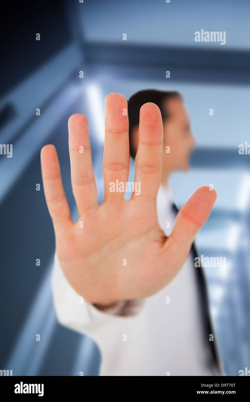 Businessman placing his hand on clear surface Stock Photo