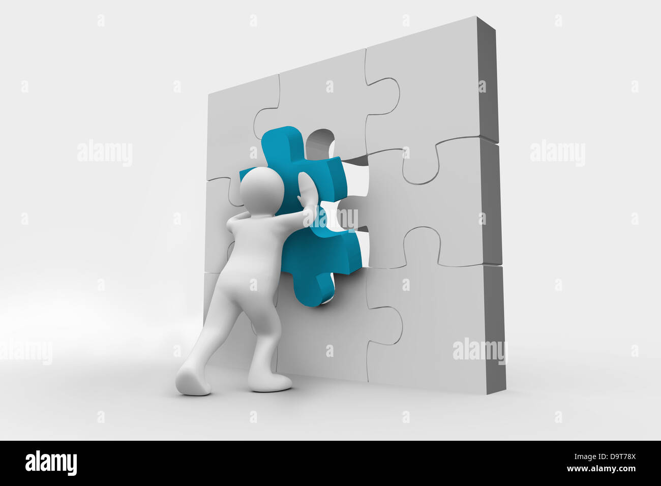 Human representation resolving a jigsaw puzzle Stock Photo
