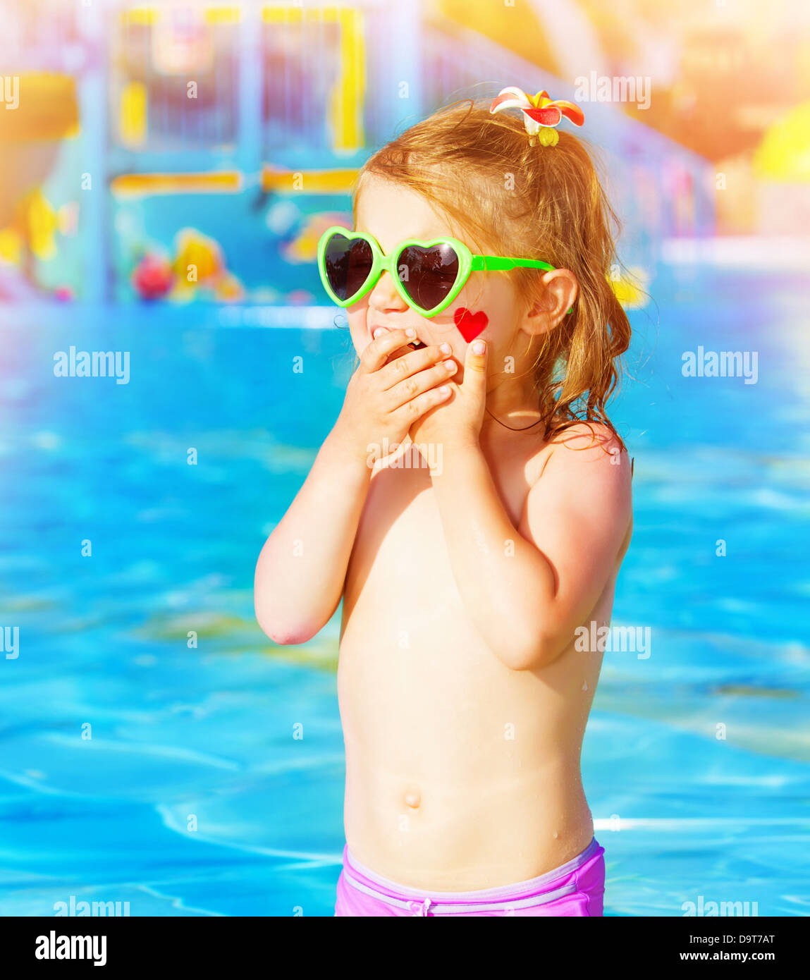 Closeup on sweet baby girl having fun in swimming pool, adorable ...