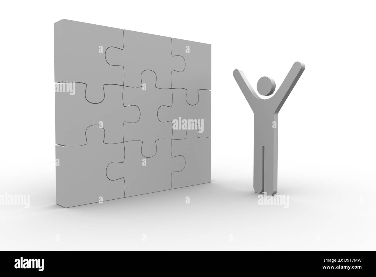 White human figure raising arms next to solved jigsaw puzzle Stock Photo
