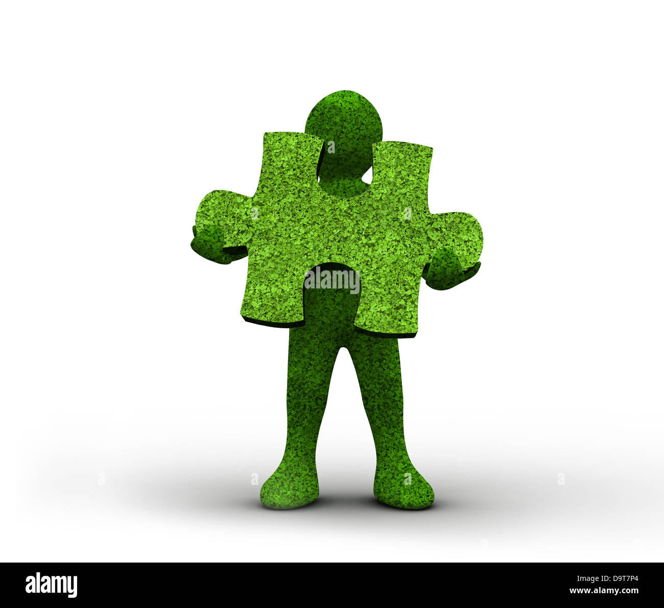 Green human representation holding a grass jigsaw puzzle Stock Photo