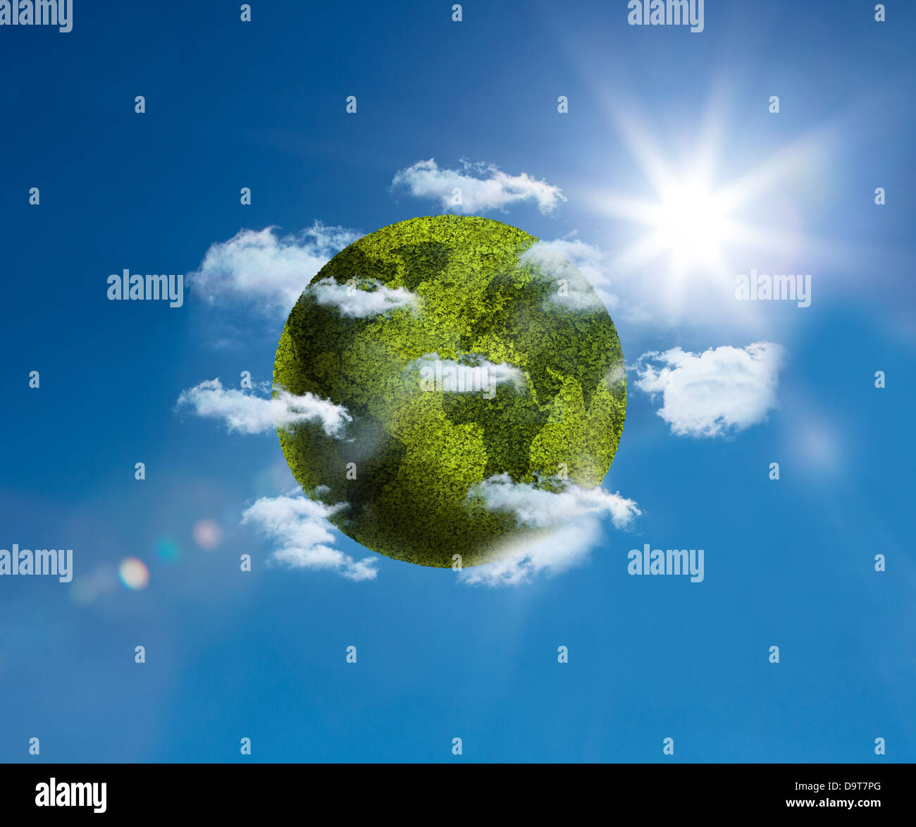 Green planet floating bright blue sky Stock Photo