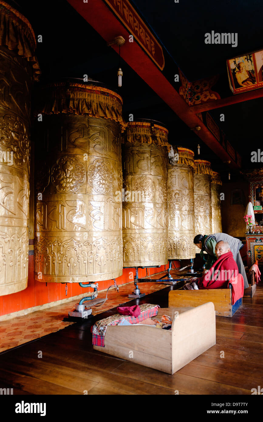 A Monk By A Prayer Wheel In The Druk Thubten Sangag Choling Gompa