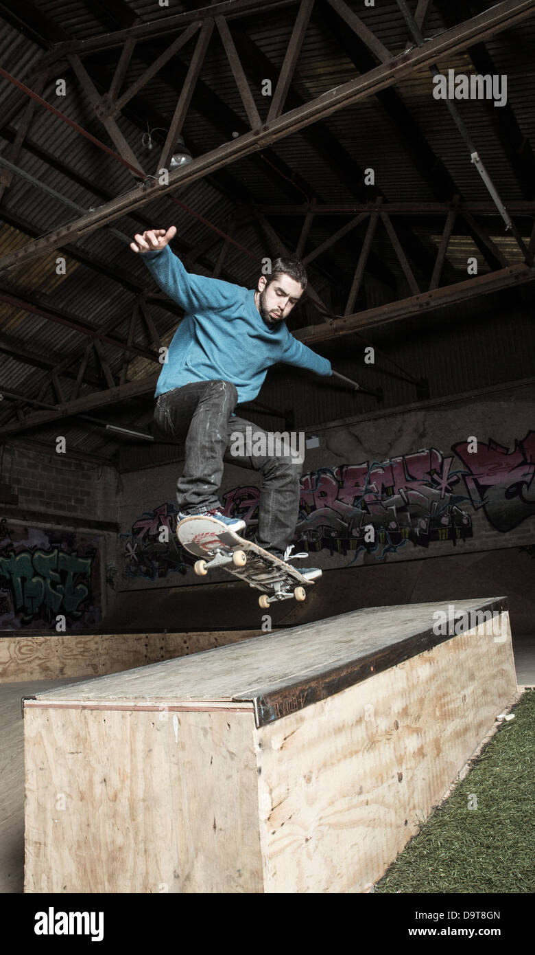 Skater doing ollie down hubba ledge Stock Photo