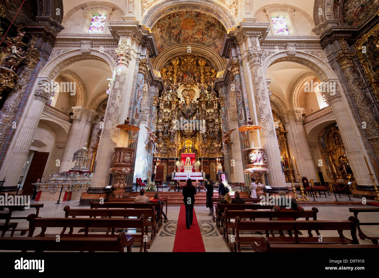 Interior with Baroque high altar in Church of the Divine Savior - Iglesia Colegial del Salvador in Seville, Spain. Stock Photo