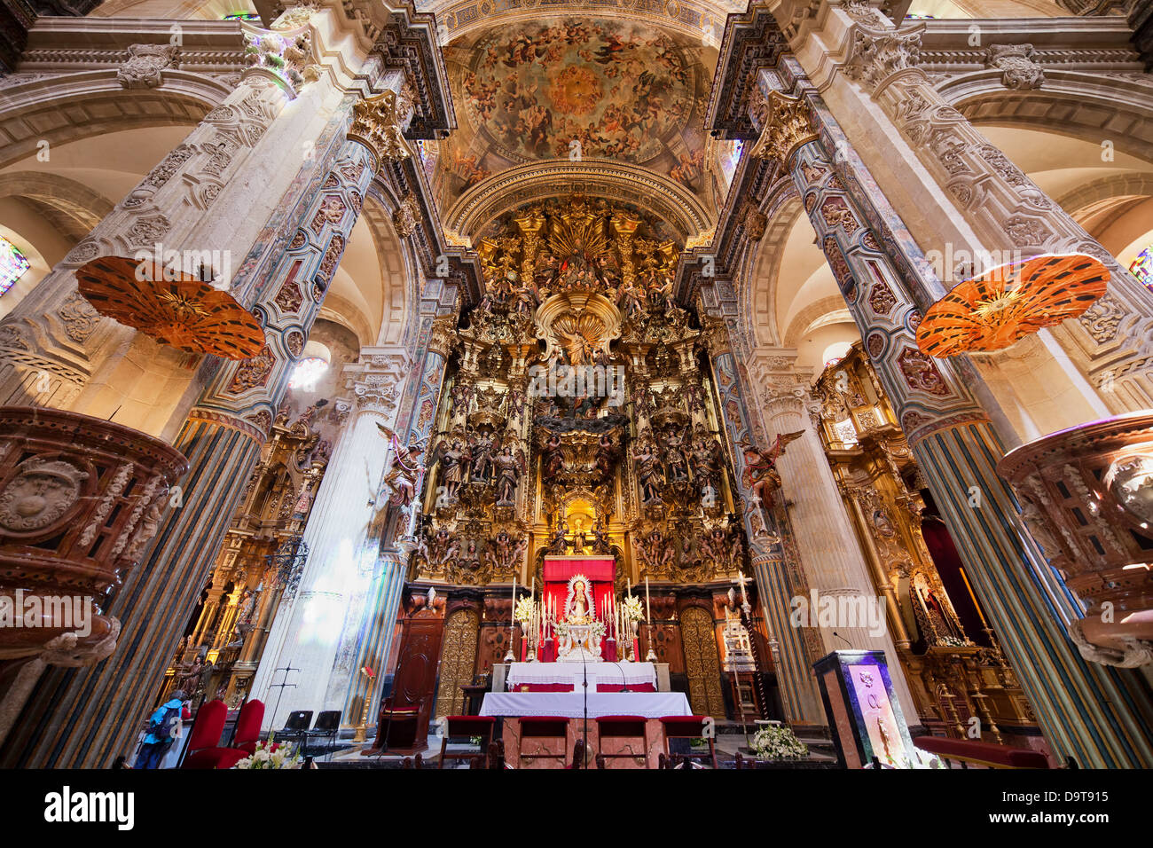 Baroque high altar in Church of the Divine Savior interior - Iglesia Colegial del Salvador in Seville, Spain. Stock Photo