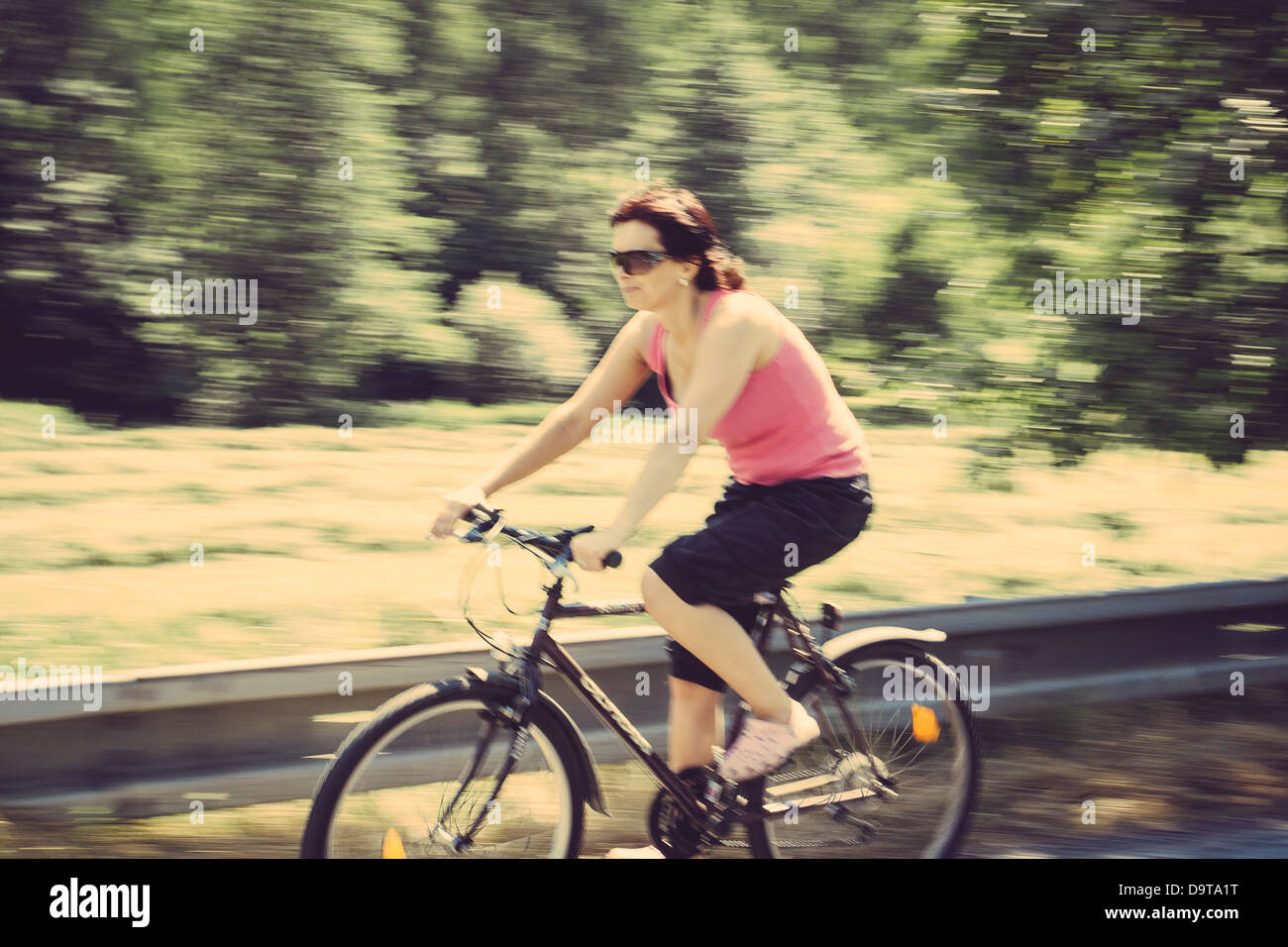 Lady riding a green bicycle hi-res stock photography and images - Alamy
