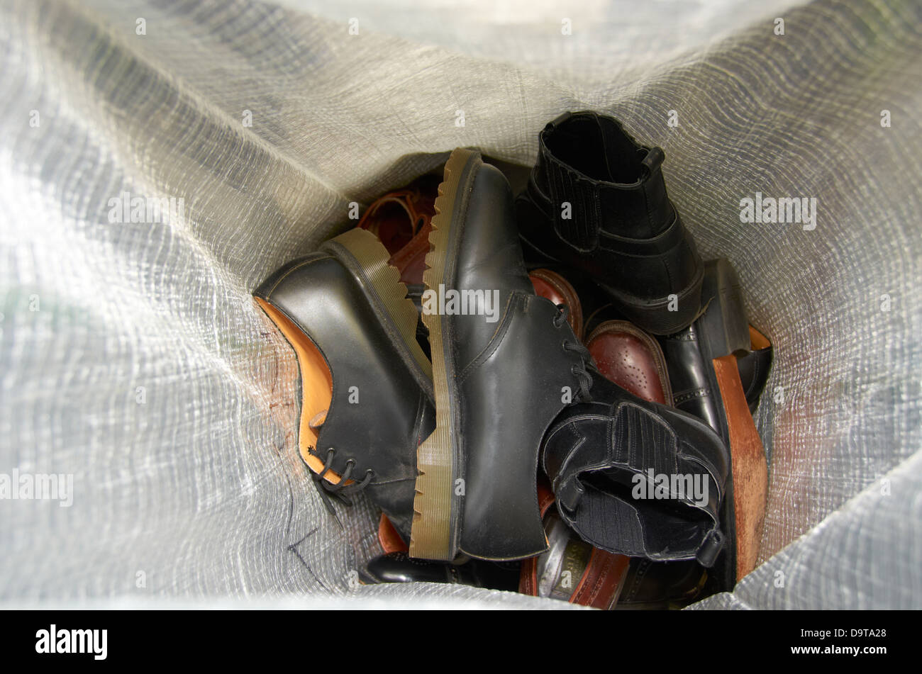 Old shoes being recycled. Stock Photo