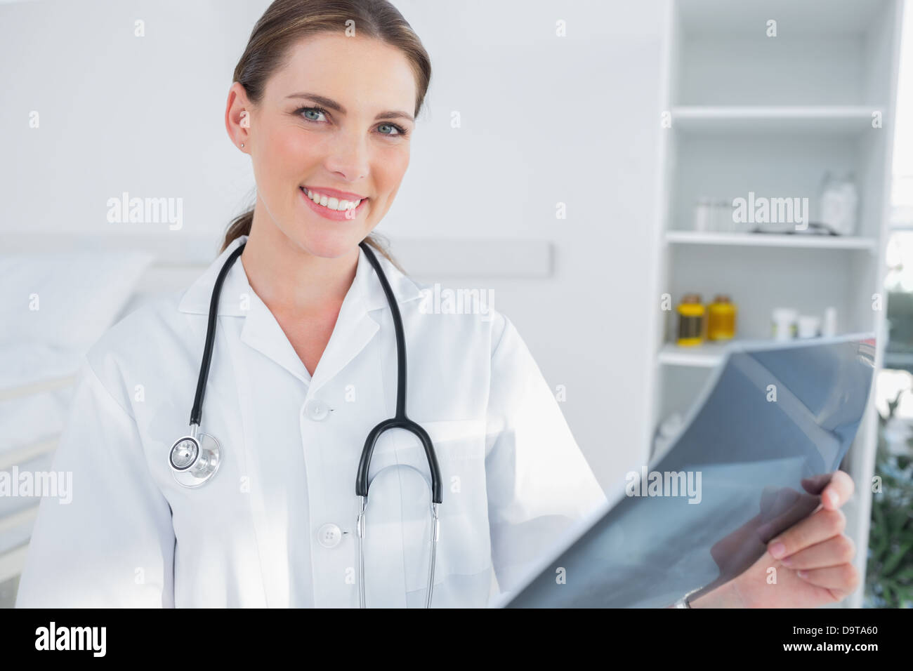 Smiling woman doctor holing a radiography Stock Photo
